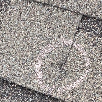 storm shingle damage